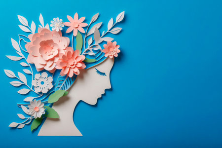 Women's profile with paper flowers. Space for textの素材