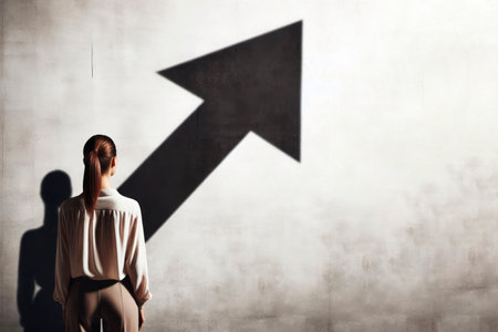 A woman in front of a wall with a shadow arrow. Space for textの素材