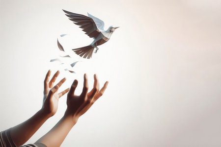 A paper bird released from his hands. Space for textの素材