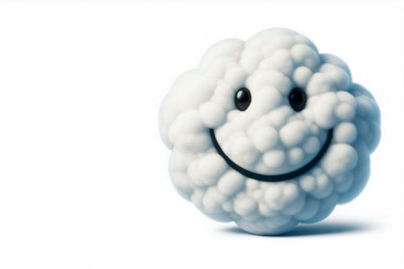 A cloud with a smile on a light background. Space for textの素材