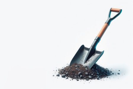 A shovel stuck in a pile of earth and gravel. Space for textの素材