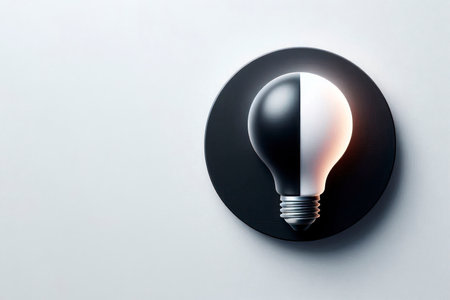 Black and white light bulb with double texture on a light background. Space for textの素材