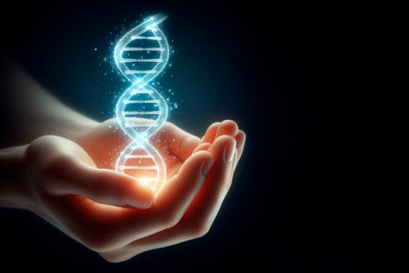 Glowing DNA structure in hands on dark background. Space for textの素材