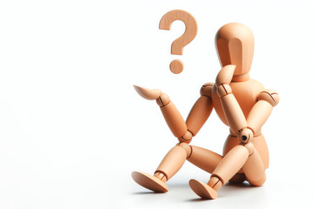 A wooden mannequin with a question mark. Space for textの素材