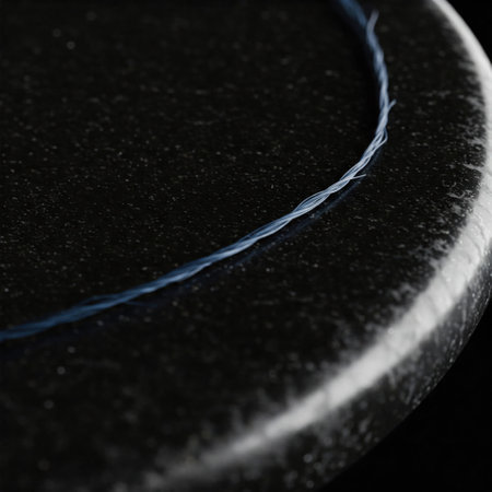 A blue twisted thread on a black surfaceの素材