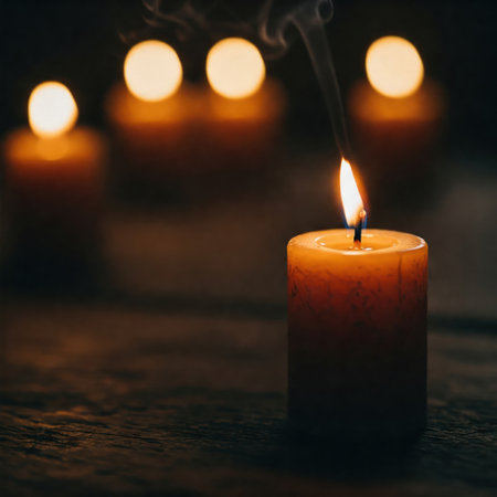 Burning candles in the dark with warm lightの素材