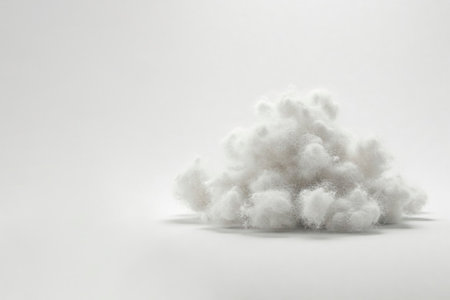 A pile of white padding on a gray background. Space for textの素材