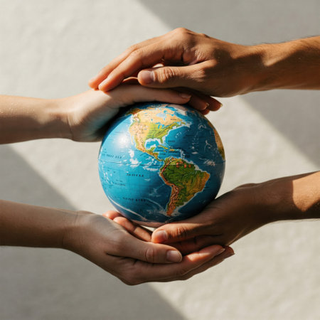 Hands hold carefully the globeの素材