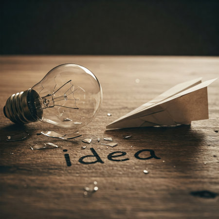 A broken light bulb and a paper airplaneの素材