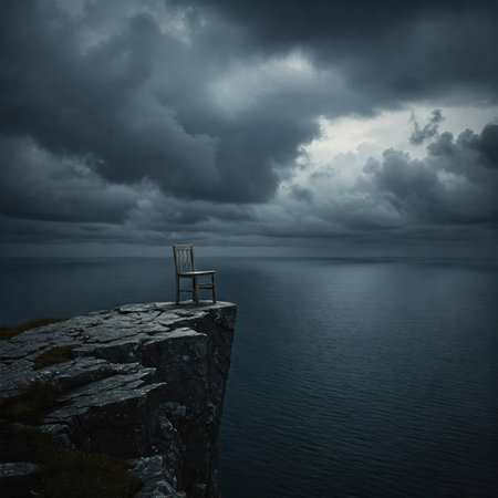 A lonely chair on the edge of a cliff above the ocean under a dark skyの素材