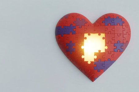 A heart of puzzles with a radiant element. Space for textの素材