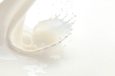 Milky splash with soft lighting on a white background. Space for textの素材