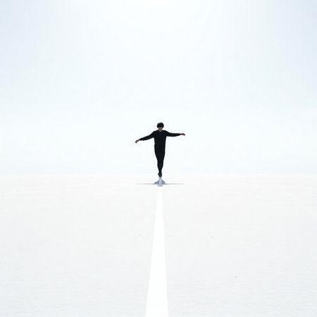 A man in black clothes is balancing on a white lineの素材