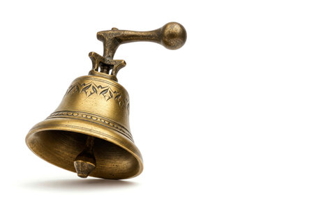 Vintage brass bell on a white background. Space for textの素材