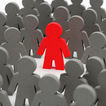 The red figure stands out among the grays against the crowdの素材