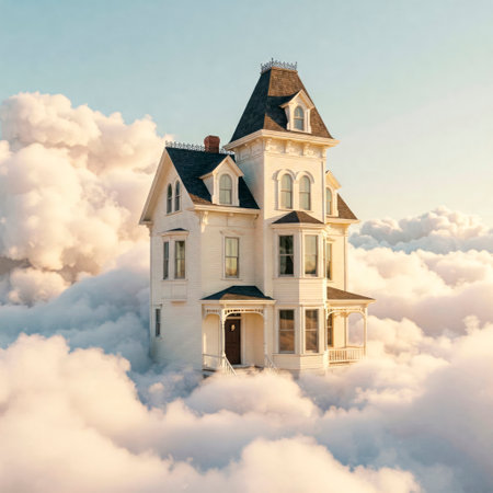 A white Victorian house in the clouds at dawnの素材