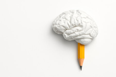 A white paper brain with a pencil. Space for textの素材