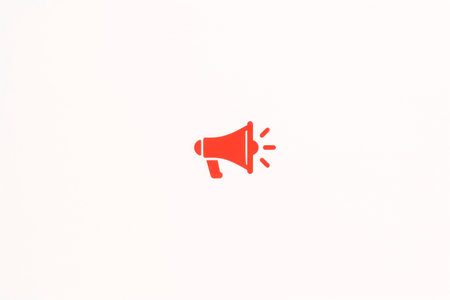 A red megaphone on a white background. Space for textの素材