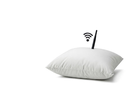 Pillow with Wi-Fi antenna on a white background. Space for textの素材