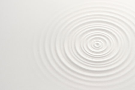 Soft circles on the surface of the water, minimalism and tranquility. Space for textの素材