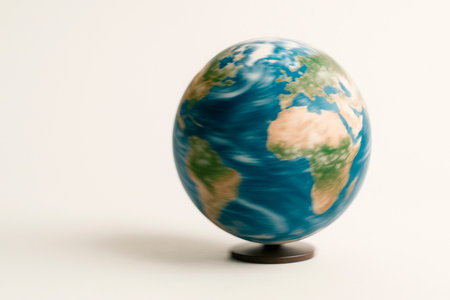 Rotating globe of the Earth on a light background. Space for textの素材