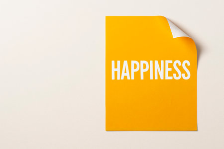 Yellow page with the inscription HAPPINESS. Space for textの素材