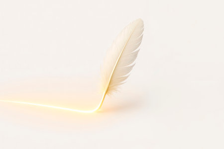 A glowing feather on a light background. Space for textの素材