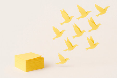 Stickers turn into yellow paper birds. Space for textの素材