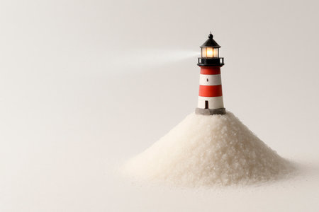 A lighthouse standing on a pile of sugar. Space for textの素材