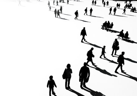 People and their long shadows on a white background. Space for textの素材