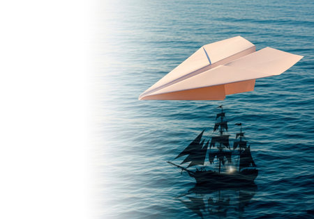 A paper plane over the sea with the shadow of a sailing ship. Space for textの素材