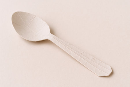A spoon made of paper, the unsuitability of the tool. Space for textの素材