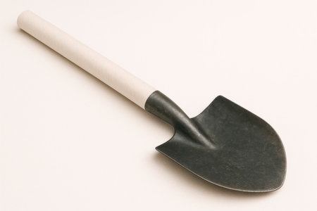 A shovel with a paper handle, a fragile tool. Space for textの素材