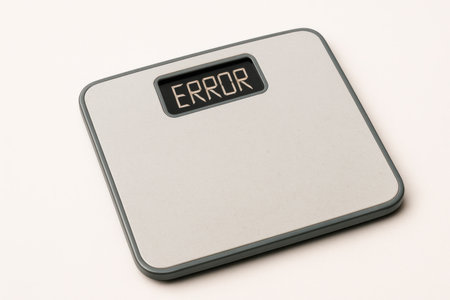 Scales with the inscription ERROR, on a light backgroundの素材