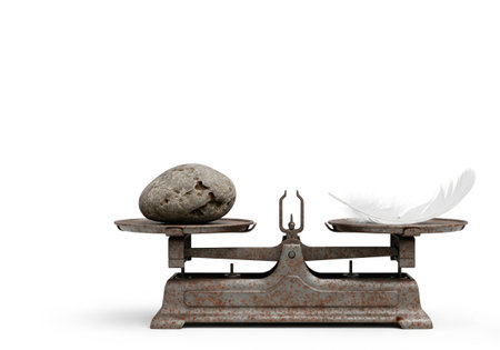 Scales with a stone and a feather. Space for textの素材