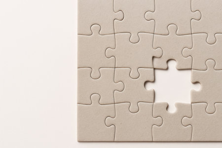 A puzzle with the missing piece in the center. Space for textの素材