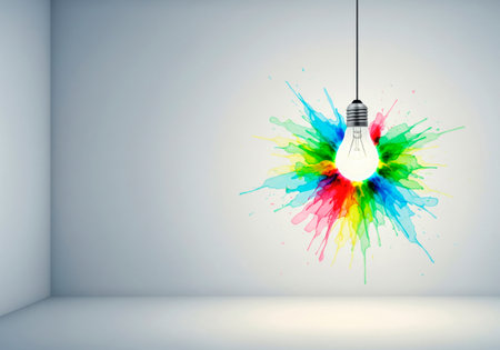 A light bulb with a bright splash of colorful colors on the wall. Space for textの素材