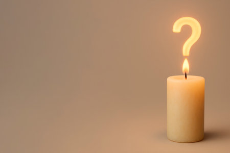 A candle with a flame in the shape of a question. Space for textの素材