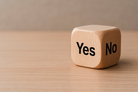A voting cube with the words yes and no. Space for textの素材