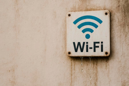 Wi-Fi sign with dripping water on the wall. Space for textの素材