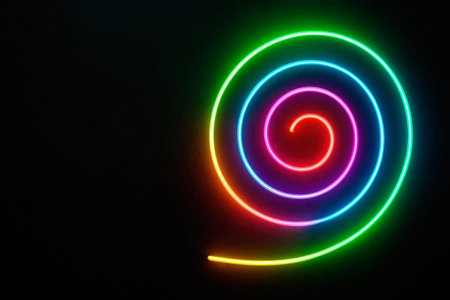 Neon spiral of multi-colored lines on a black background. Space for textの素材