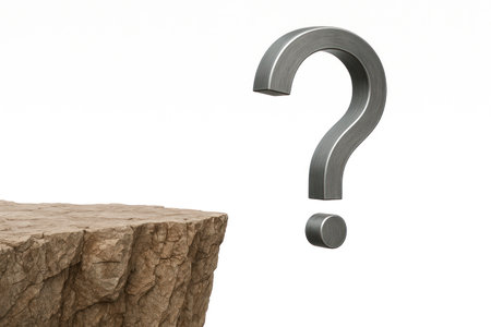 A steel question mark over the edge of the cliff. Space for textの素材