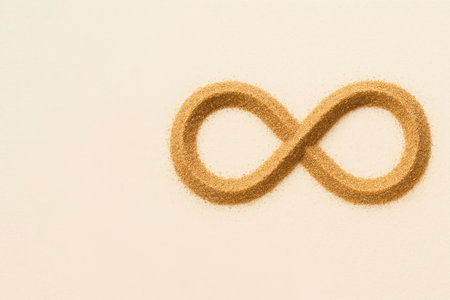Infinity sign made of sand on a light background. Space for textの素材