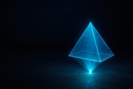 A blue holographic pyramid hovering in the dark. Space for textの素材
