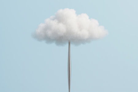 A white cloud pierced by a sharp metal needle in the blue sky. Space for textの素材