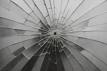 A crack in the glass with rays radiating from the centerの素材