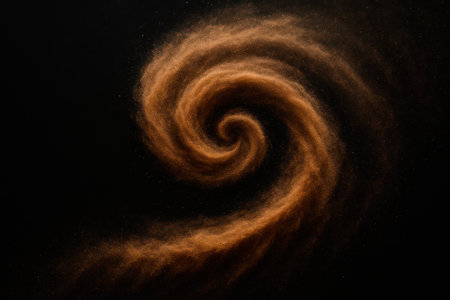 Golden spiral vortex of dust on a black backgroundの素材