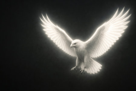 A glowing bird with spread wings on a dark background. Space for textの素材