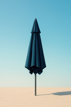 A single umbrella in the desert against the skyの素材