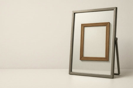 Mirror with inner frame on the table. Space for textの素材